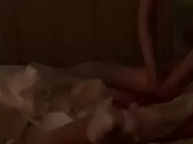 Asian masseuse with fake tits gives a covered blowjob. Voyeur Asian Massage parlor
